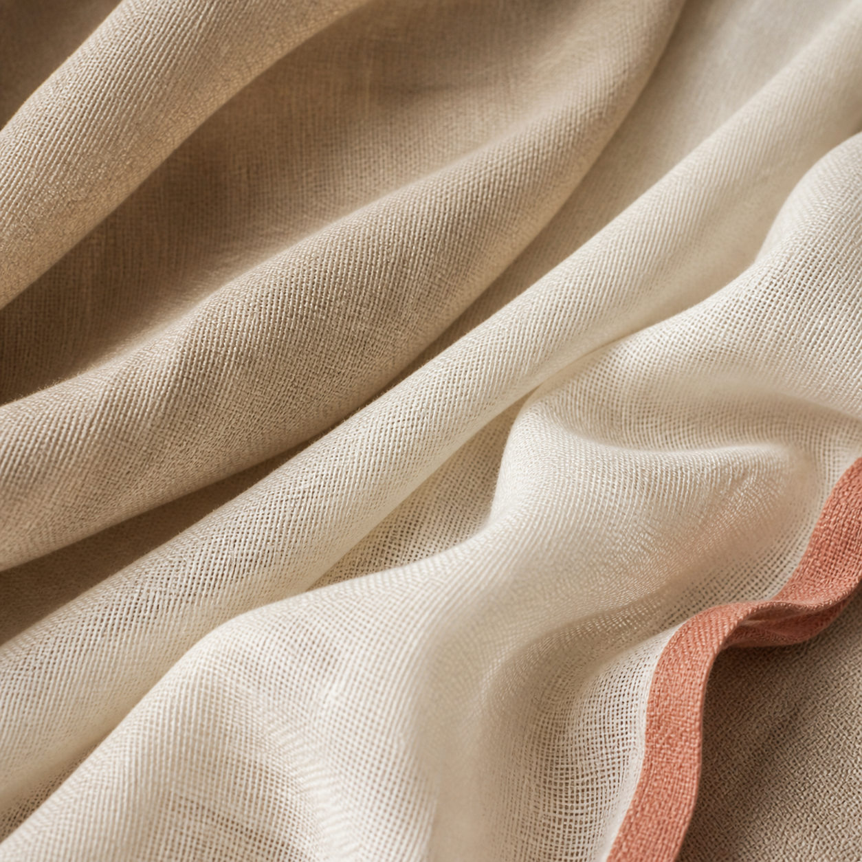 Close detail of warm ivory and oat furnishing fabrics